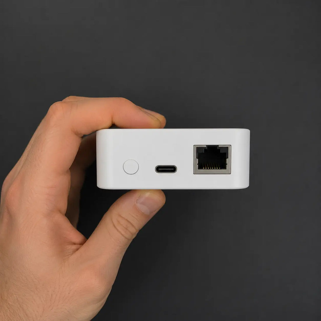 vploq device held in a hand, showing the size